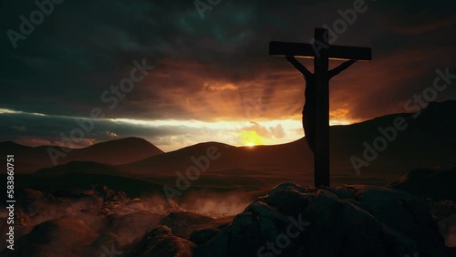 The silhouette of the cross with the crucifixion of Jesus Christ on Mount Calvary against the background of dark clouds and an orange sunset. The concept of the holiday of Easter, Holy Week, resurrect photo