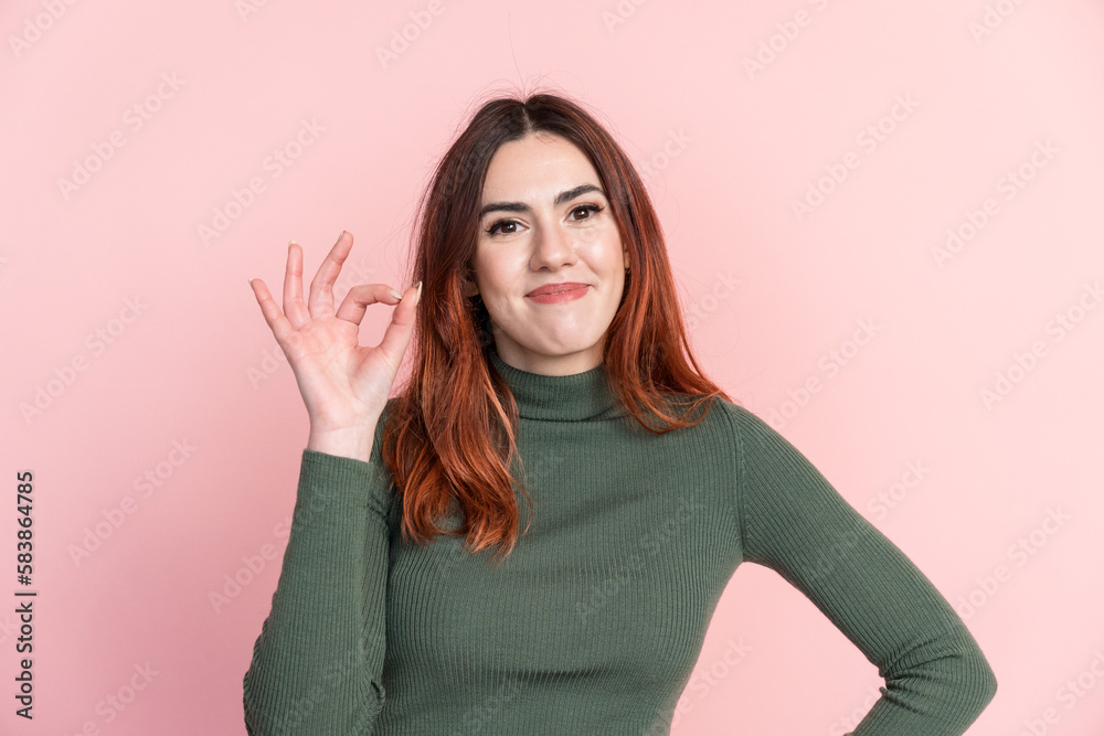 Smiling woman showing OK gesture Smiling woman showing OK gesture