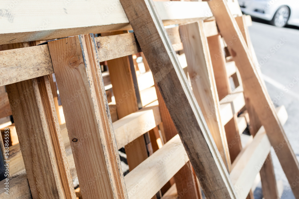 Wooden pallets stacked outdoors. building materials Wooden pallets stacked outdoors. building materials