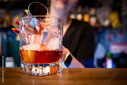 Fototapeta Naklejka Na Ścianę i Meble -  woman hand bartender making negroni cocktail