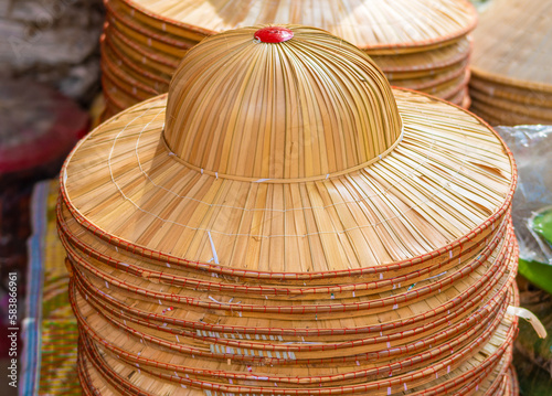 Vietnam, traditional straw hats exposed in a market place