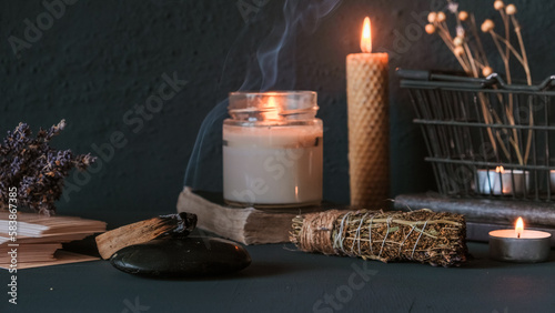 Tarot, astrology,Esoteric, Occult mystical ritual scene of sorcery tarot candles,dried flowers, palo santo tarot cards, ritual book.Witchcraft,mysticism and occultism,esoteric background,tarot banner photo