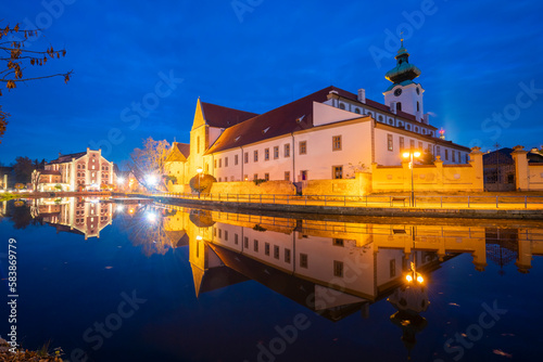 Dominican Monastery reflecting in Malse River at twilight, Ceske Budejovice, South Bohemian Region photo