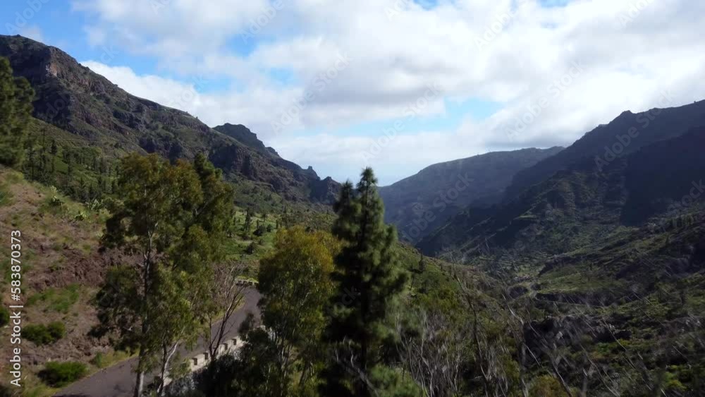 Drone shot flying over mountain road with beautiful nature landscape Drone shot flying over mountain road with beautiful nature landscape