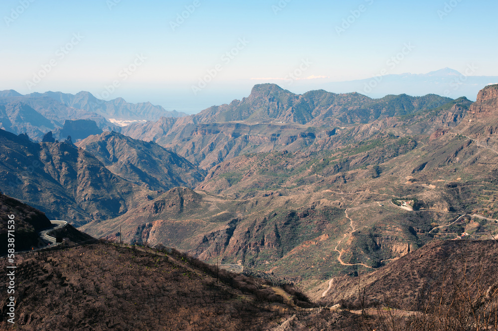 View on Gran Canaria mountains and twisty road from village Crus de Tejede, Spain