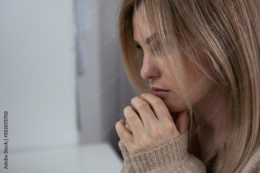 Closeup portrait of a young woman praying. Closeup portrait of a young woman praying.