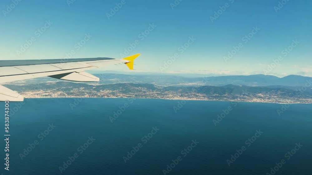 Plane arriving at its destination. City in the background. Plane arriving at its destination. City in the background.