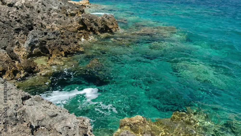 Video of the rocky shore of Crete Island with turquoise clear Mediterranean sea water. Greece Video of the rocky shore of Crete Island with turquoise clear Mediterranean sea water. Greece