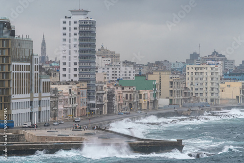Storm waves batter the seafront Malecon with its faded grandeur stucco houses on Malecon, Havana