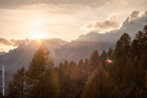 The Sun is setting behind the mountain peaks of Alpe Devero, Northern Italy