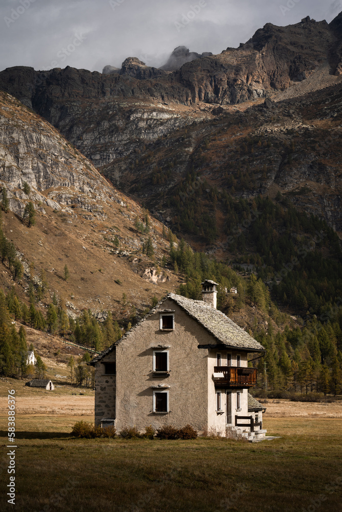 An isolated mountain hut located in the highland of Alpe Devero, Northern Italy, during morning