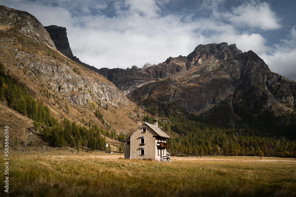 An isolated mountain hut located in the highland of Alpe Devero, Northern Italy, during morning