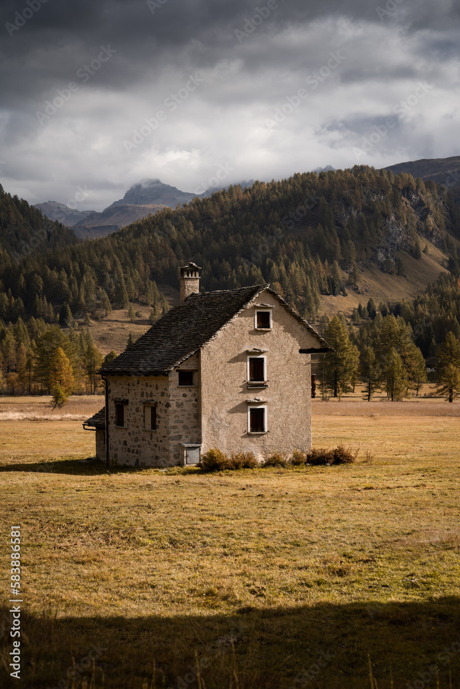 An isolated mountain hut located in the highland of Alpe Devero, Northern Italy, during morning