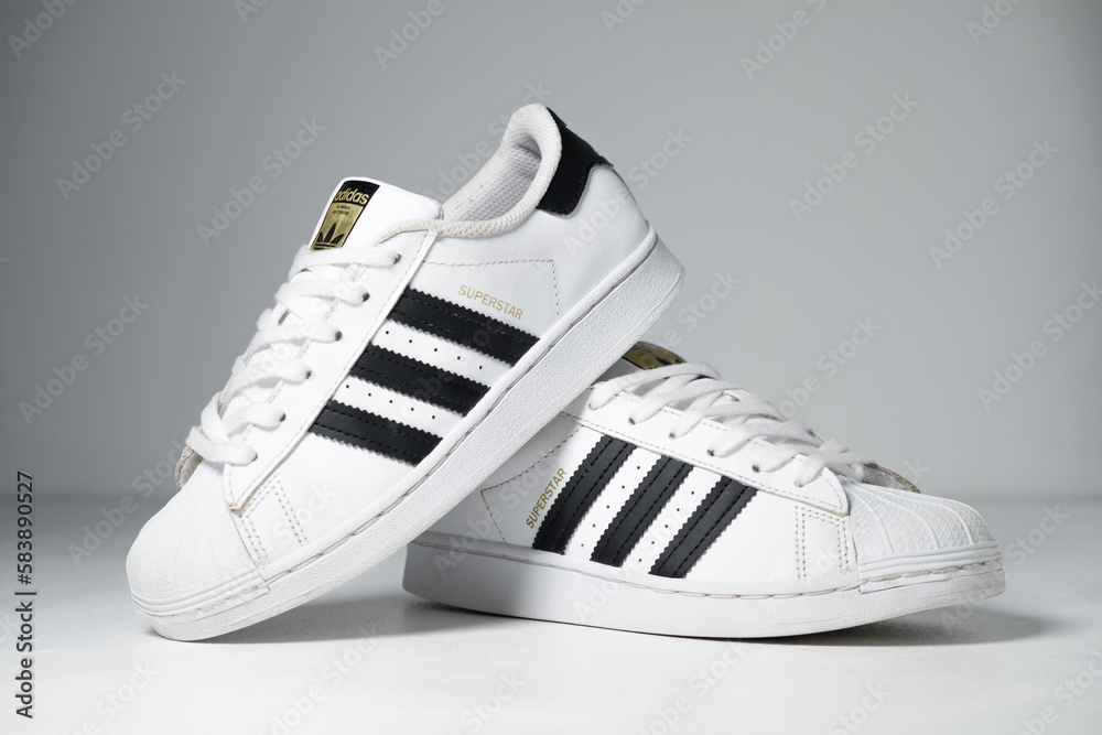 kent, uk adidas Originals Superstar White and stripes. Trainers Shoes hip hop style vintage sneaker trainers. adidas superstar trainers, stylish retro new york fashion. Photo | Adobe Stock