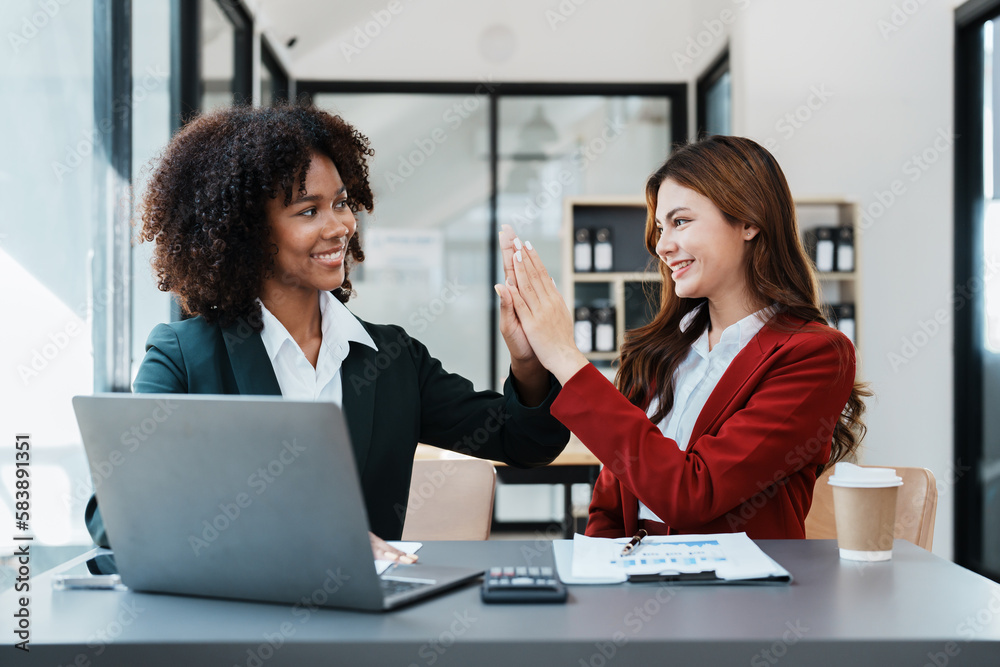 Fototapeta premium Multiethnic business, Beautiful American African and asian businesswoman people meeting Diverse Happy people celebrating success at company, teamwork, triumph, victory, achievement concept