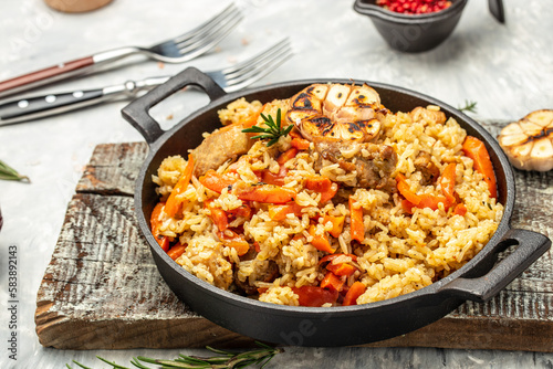 pilaf with beef, carrot in cast-iron pan. banner, menu, recipe place for text, top view