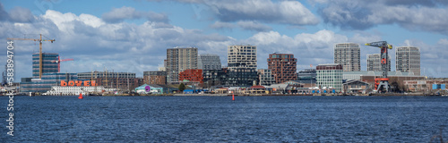 Photography Panoramic view from the IJ river to NDSM neighborhood (Amsterdam-Noord borough), located on the former terrain NDSM-wharf, along the IJ river