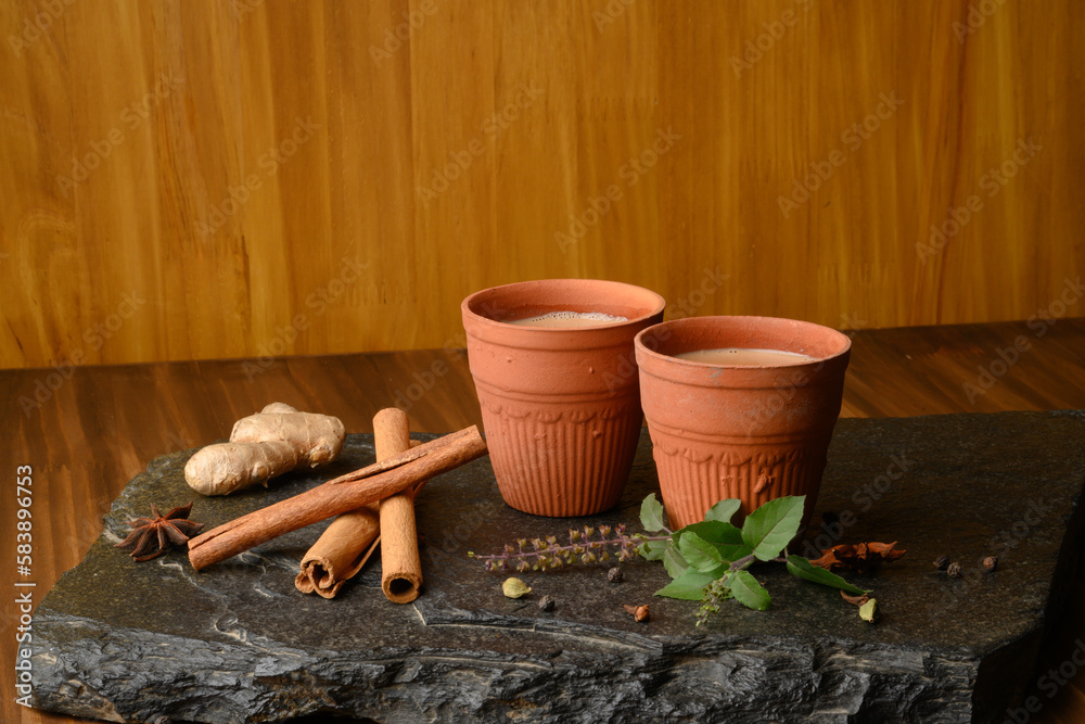 Earthen tea cup or Chai in kulhad with Ginger, Cardamom Cinnamon tulsi  Stock Photo | Adobe Stock