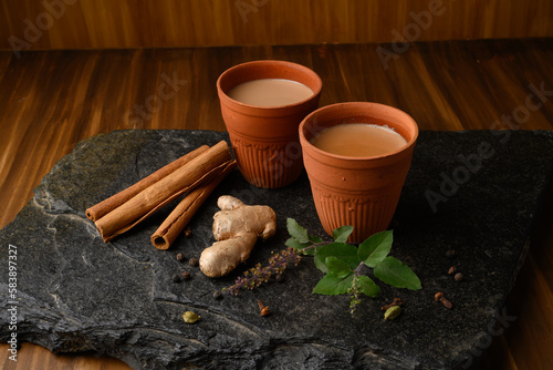 Earthen tea cup or Chai in kulhad with Ginger, Cardamom Cinnamon tulsi