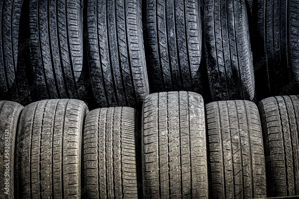Two stacks of new tires outside a garage in Binghamton in Upstate NY. Two stacks of new tires outside a garage in Binghamton in Upstate NY.