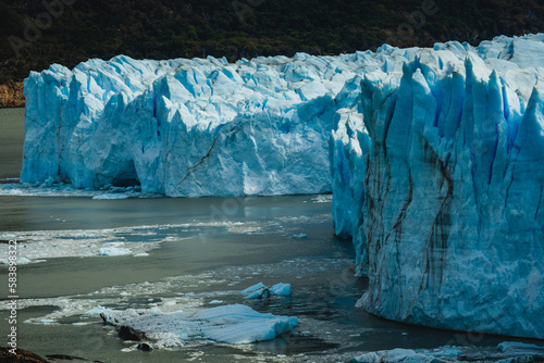  iceberg glacier under hot sun in Antarctica , glacier melting causing rising sea level global warming climate change concept © Michele