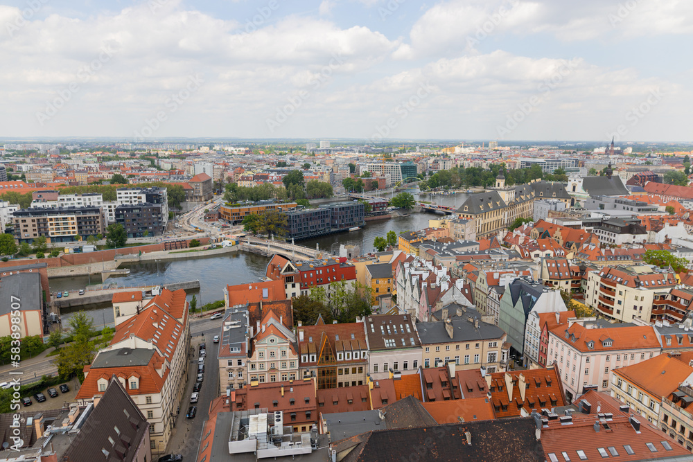 Top view of Wroclaw. City center with colorful houses with red roofs and and river with a bridges, Poland