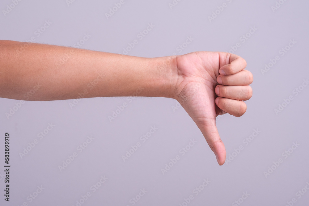 Hand thumb down isolated on the left side on white background. Rejection symbol Hand thumb down isolated on the left side on white background. Rejection symbol