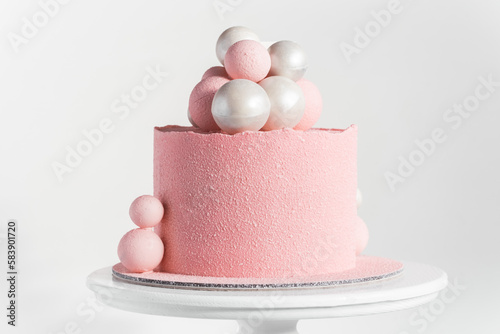 Fotografie Birthday cake with pink velvet sprayed coating decorated with silver and pink ch