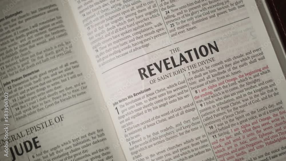 Open Bible chapter Revelation by John close up camera movement to the right on title. Open Bible chapter Revelation by John close up camera movement to the right on title.