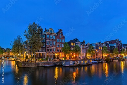 Amsterdam Netherlands  night city skyline at canal waterfront