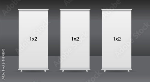 Set of 3 empty standee or rollup banner display mockup on isolated white background. Display mockup for presentation or exhibition product. Vertical blank roll up stand template in 1x2 sizes.
