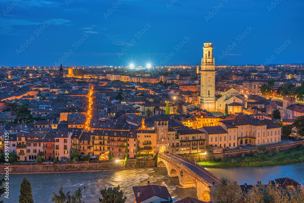 Verona Italy, high angle view night city skyline at Adige river and Verona Cathedral