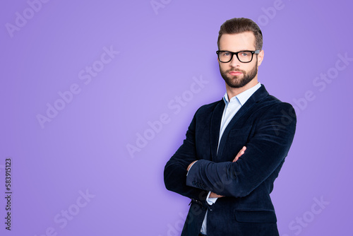 Portrait with copy space, empty place for advertisement of elegant half turned teacher with stubble having his arms crossed looking at camera isolated on grey background