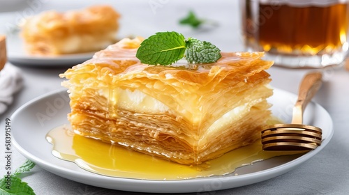 Galaktoboureko - Creamy Custard-Filled Filo Pastry with a Golden Crispy Crust and Honey Syrup photo