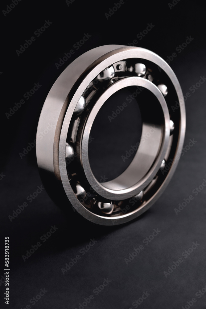 ball bearing on a black background close-up, blur as an artistic device ball bearing on a black background close-up, blur as an artistic device