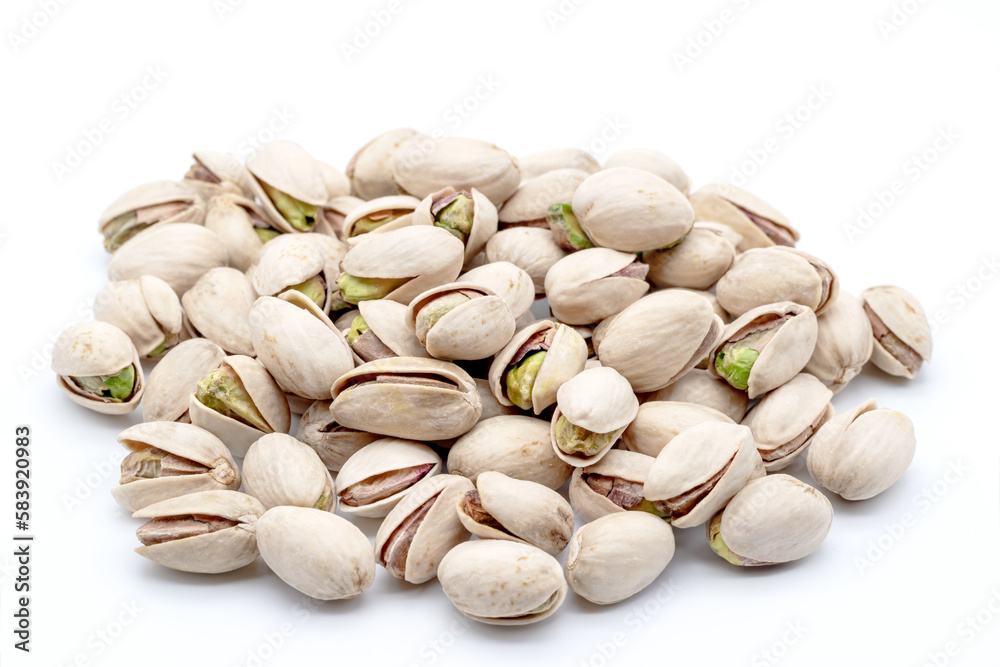 heap of natural pistachios on a white background