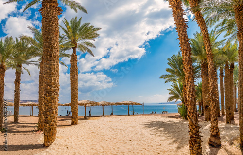 Morning on renovated sandy beach of the Red Sea in Eilat - famous tourist res...