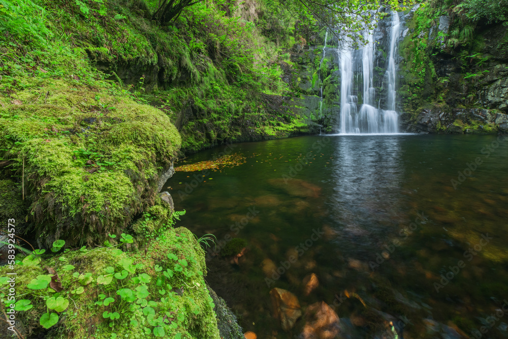 Amazing rapid waterfall in mountains Amazing rapid waterfall in mountains