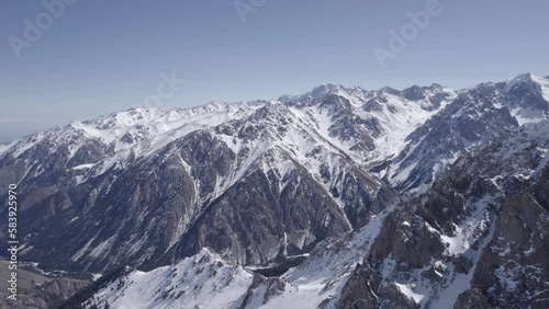 Aerial shot of stunning snow covered mountain range