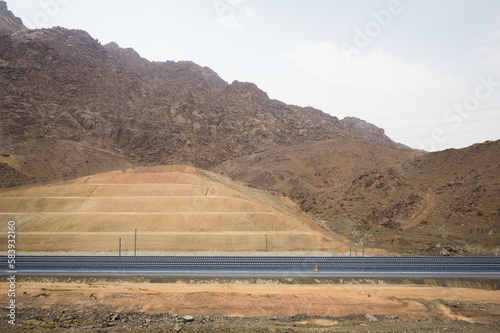 Dual gauge railway tracks with power lines photo