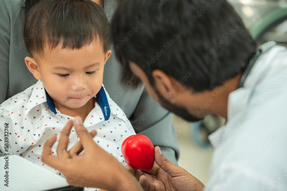 pediatrician hold stethoscope exam child boy patient with mother, black pediatrician seduce by toy kid pediatric checkup in hospital children medical care pediatrician hold stethoscope exam child boy patient with mother, black pediatrician seduce by toy kid pediatric checkup in hospital children medical care