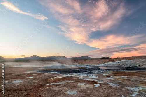 Boiling mudpots in Hverir geothermal area in Myvatn region, North of Iceland photo