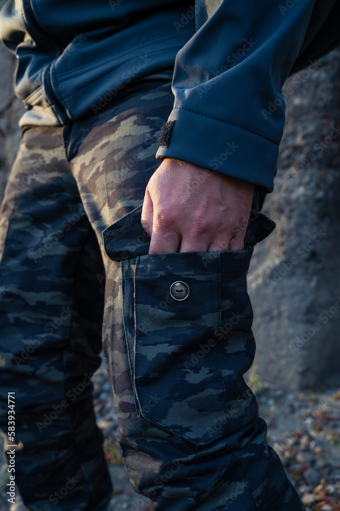 Man tourist standing in military outfit outdoor. Travel or military concept Man tourist standing in military outfit outdoor. Travel or military concept