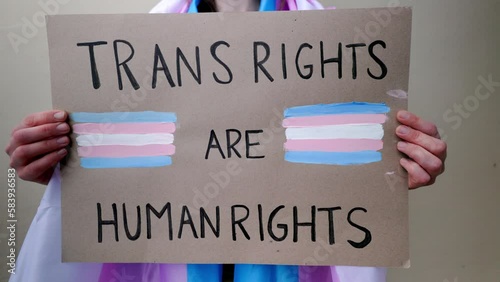 Trans support sign: Transgender people protest for human rights at gay festival parade - LGBTQ awareness photo