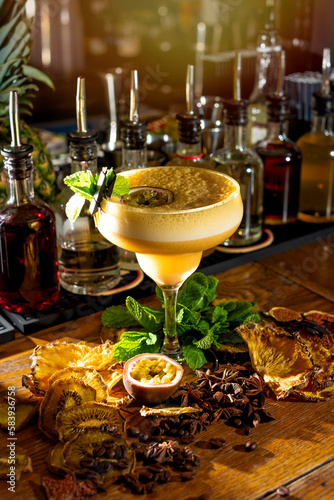Alcoholic cocktail. Egg liqueur in a glass and ingredients for cocktails on the bar counter