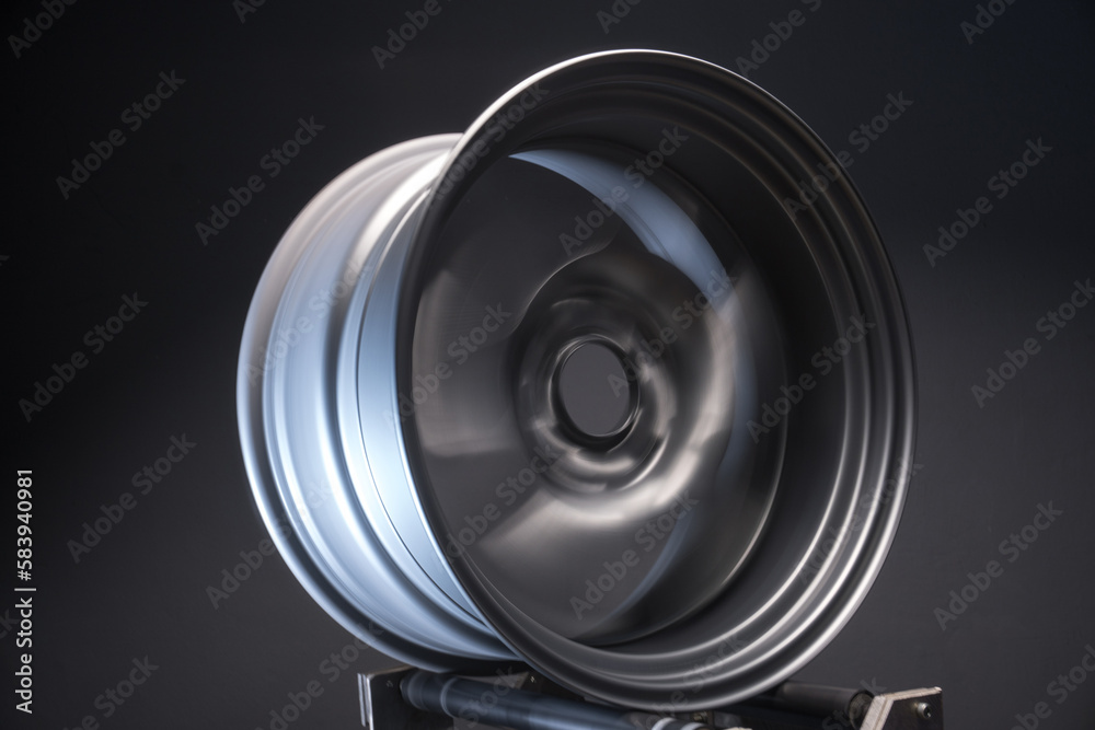 sports metallic gray car rims extended long exposure photography for motion blur effect when rotating