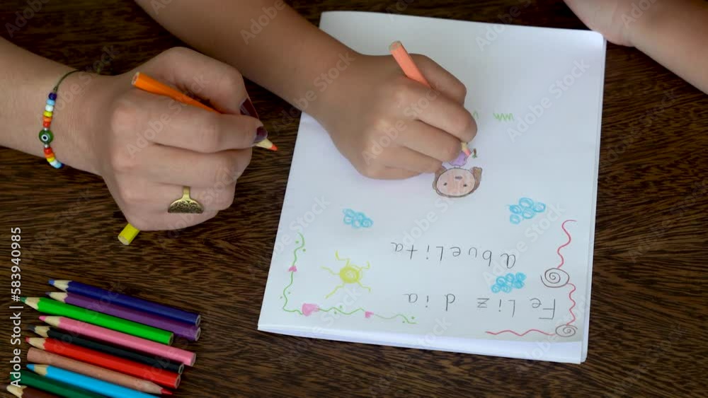 Mom and daughter make card for grandma for mother's day Mom and daughter make card for grandma for mother's day