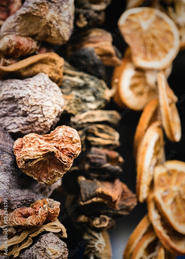 Closeup of dried mushrooms and lemons on black background Closeup of dried mushrooms and lemons on black background