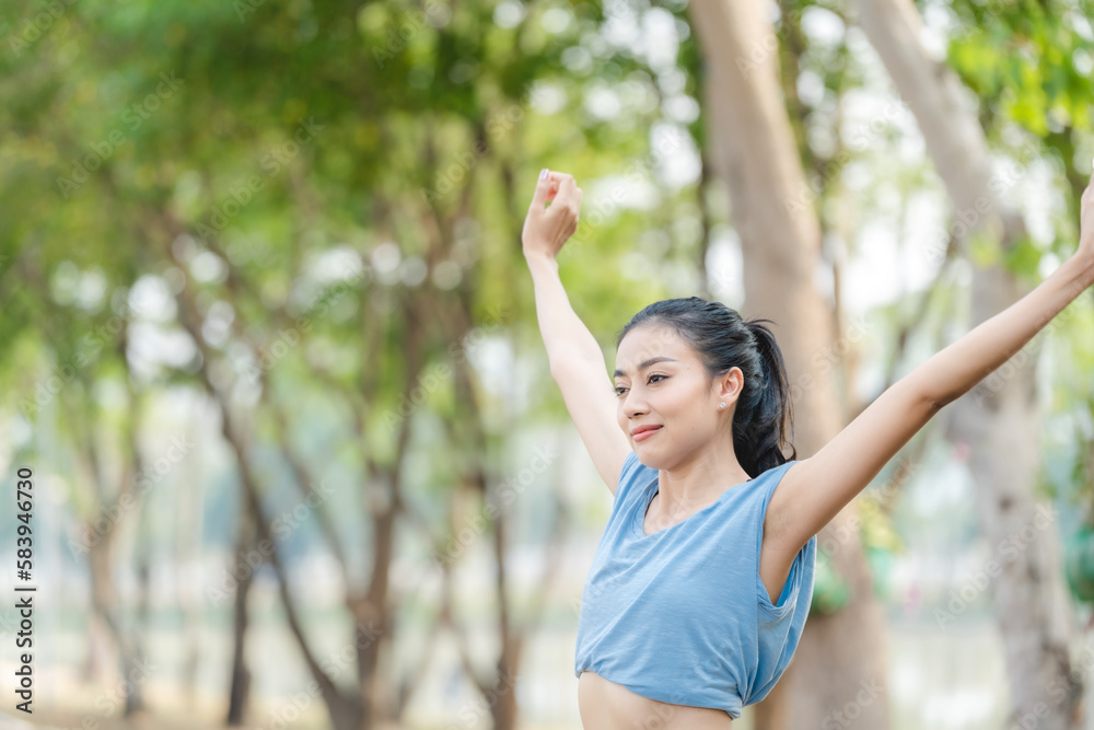 Asian woman stretching body and neck after jogging exercise at park in the city. Attractive athlete girl in sportswear enjoy outdoor lifestyle sport training fitness running workout in morning summer Asian woman stretching body and neck after jogging exercise at park in the city. Attractive athlete girl in sportswear enjoy outdoor lifestyle sport training fitness running workout in morning summer