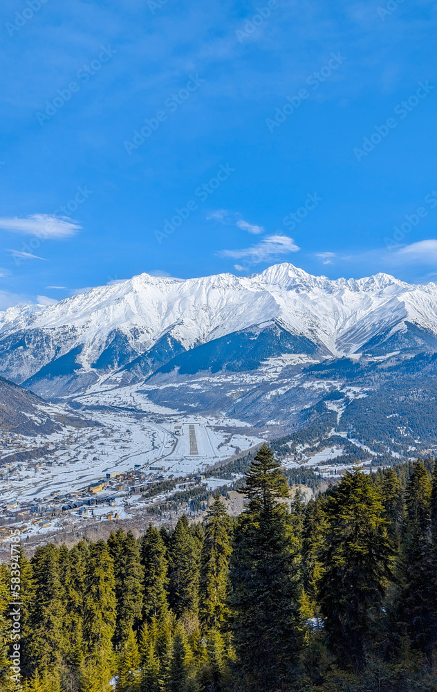 Snowy forest with mountain views of Svaneti, Mestia